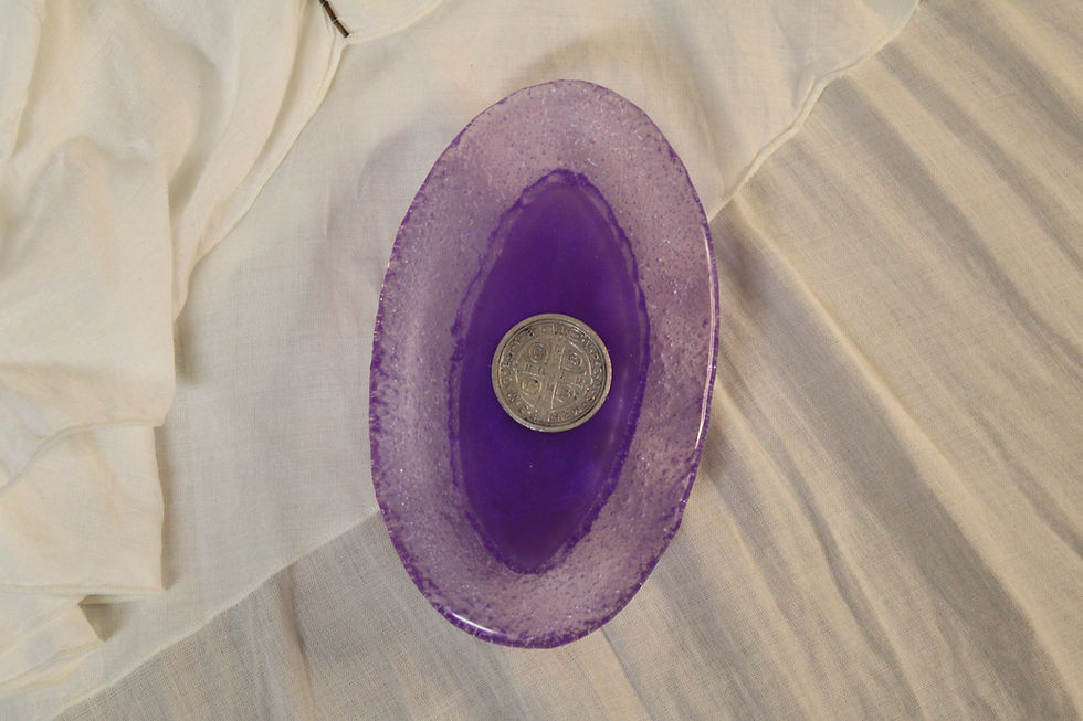 Thumbnail: Arial view of a purple Catholic soap dish made of epoxy resin with a St. Benedict Medal sacramental.