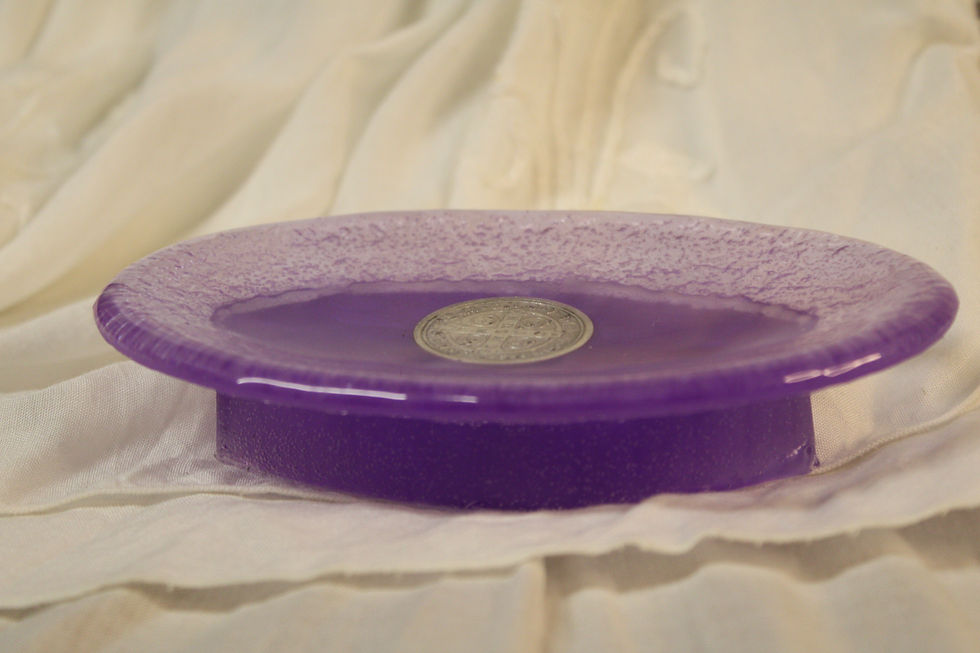 Side view of a purple Catholic soap dish made of epoxy resin with a St. Benedict Medal sacramental.