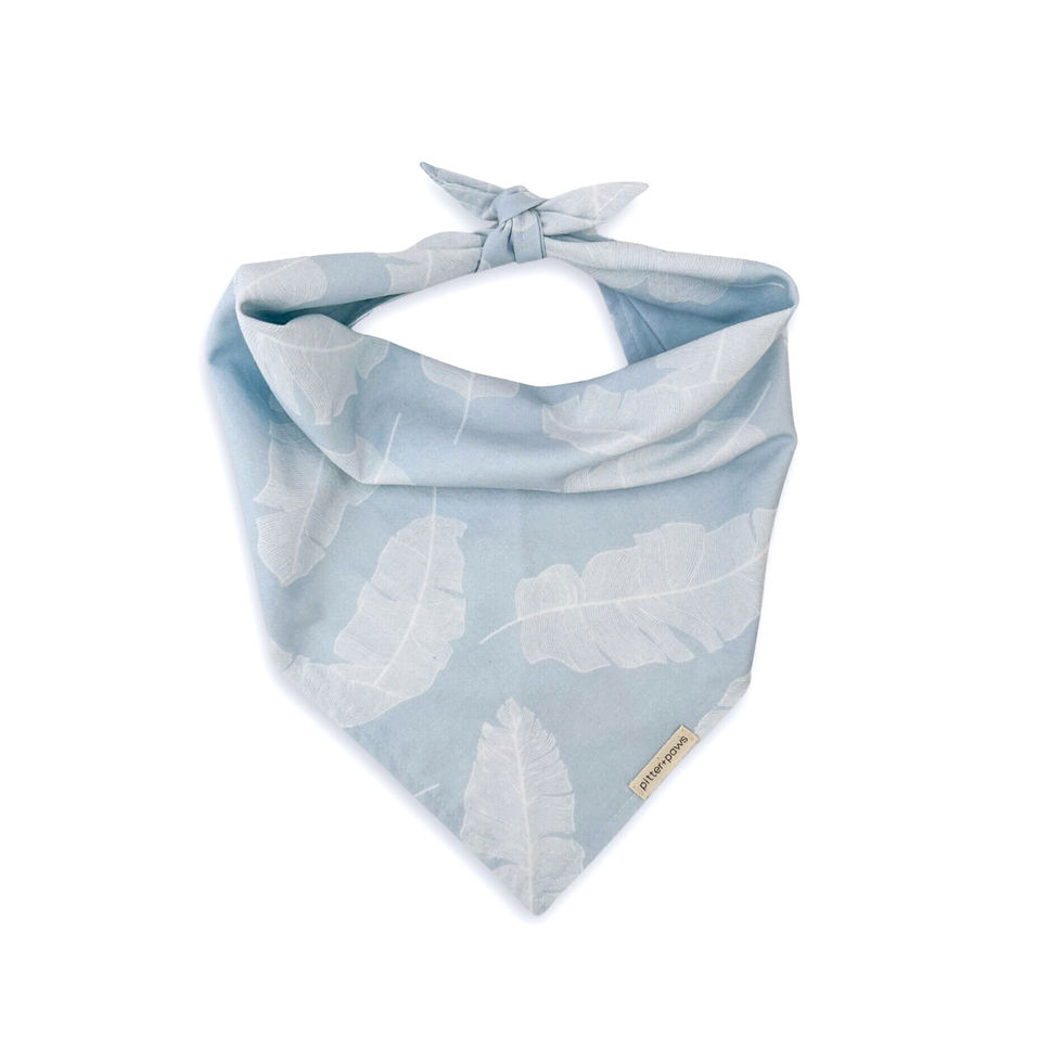 Misty Palm classic tie-on bandana features a delicate pattern of white banana palms on a cool misty blue field.