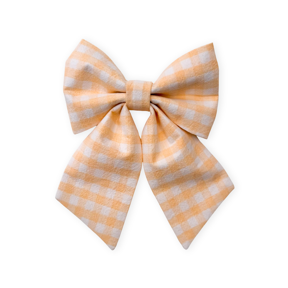 Spring dog sailor bow in a pastel yellow gingham.