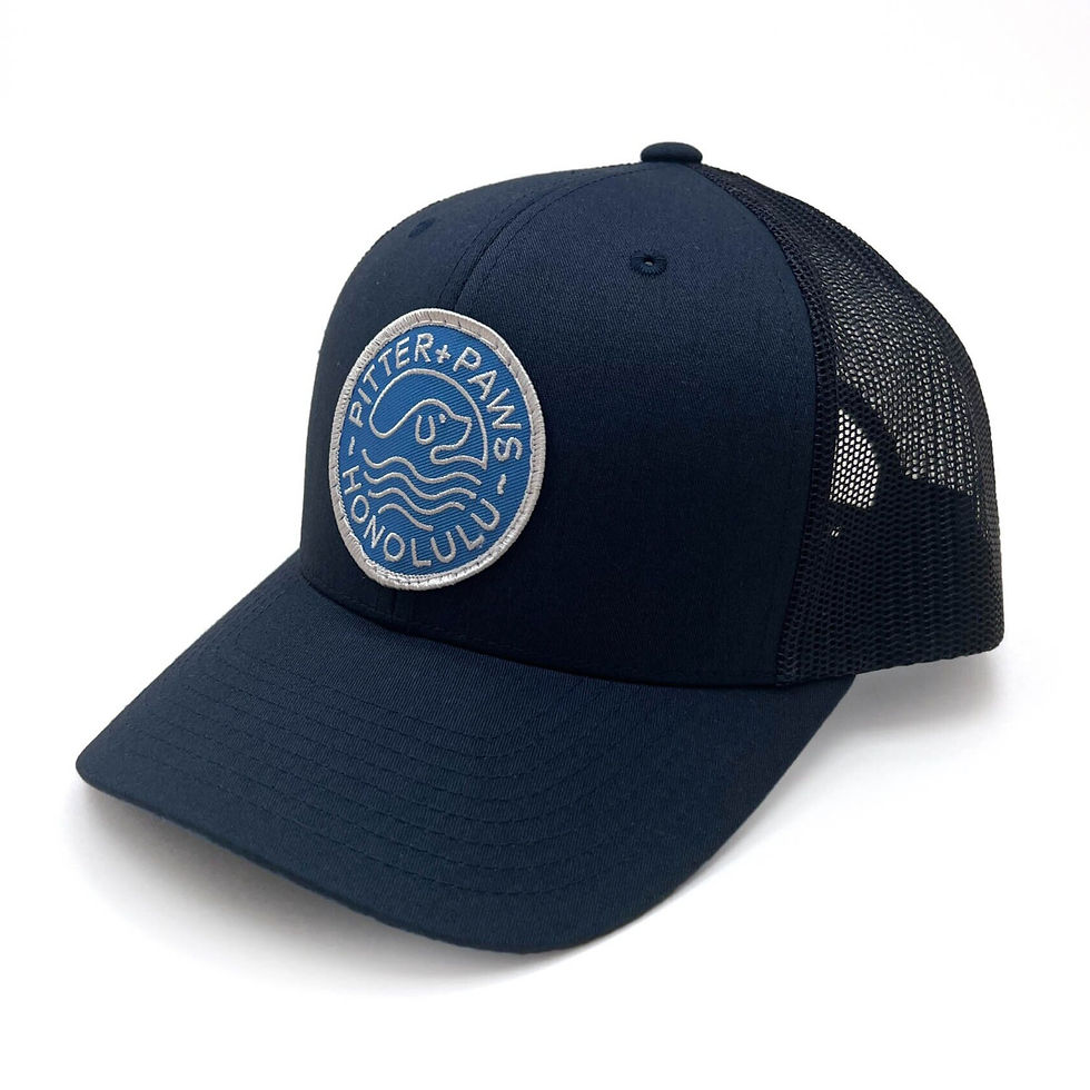 Navy blue baseball cap with a Bitter+Paws Honolulu logo patch