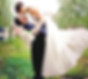A groom holding his newly-wed bridge in a Monet inspired garden.