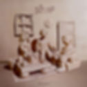 Clay sculpture of three seated figures around a low table in a beige room, with Soft No above and Super Neutral below.