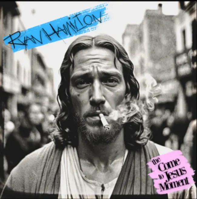 A man smokes a cigarette on a street. He has long hair, a beard, and wears a robe. Text reads "Ryan Hamilton" and "The Come to Jesus Moment."