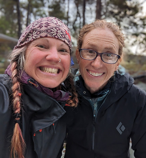 Two happy and empowered women smiling together, forming a strong bond
