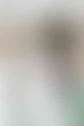 Bride laughing with groomsmen