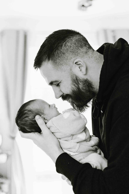 Man holding his newborn son