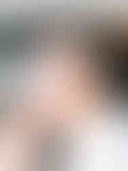 Brunette bride having her makeup done