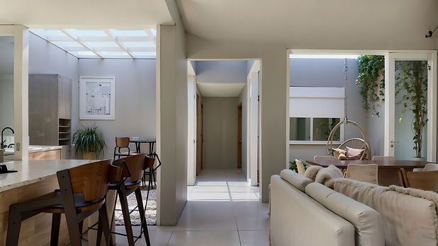 Para atender às demandas do casal, que desejava uma casa térrea com três dormitórios e uma área social para receber amigos em seu terreno de 140m², adotamos uma abordagem cuidadosa no projeto.

Assim, optamos por integrar a sala de estar, jantar e a cozinha em um único espaço, integrando ainda de forma harmoniosa a área gourmet e o jardim de inverno à essa área, o que era um desejo antigo da futura moradora, mas desafiador dada as dimensões do terreno. Como resultado, proporcionamos um ambiente versátil para encontros e eventos e visualmente mais espaçoso.

Outra estratégia adotada foi a inclusão de uma ampla abertura na sala, que se conecta à garagem, oferecendo a possibilidade de expandir a área de convivência para acomodar um maior número de pessoas quando necessário. Dessa forma, conseguimos atender plenamente às necessidades do casal, proporcionando um ambiente aconchegante e funcional para suas celebrações e momentos de convívio com amigos e familiares.