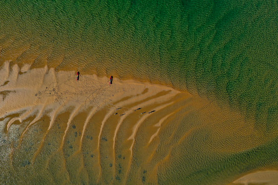 Aerial view of tidal sand ripples and shallow green water near Seventeen Seventy