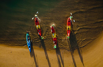 Happy paddlers on 1770 Liquid Adventures sunset kayak tour with free photos included, Town of 1770