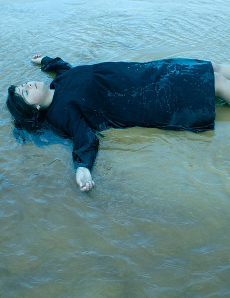 Image of a girl laying in the water