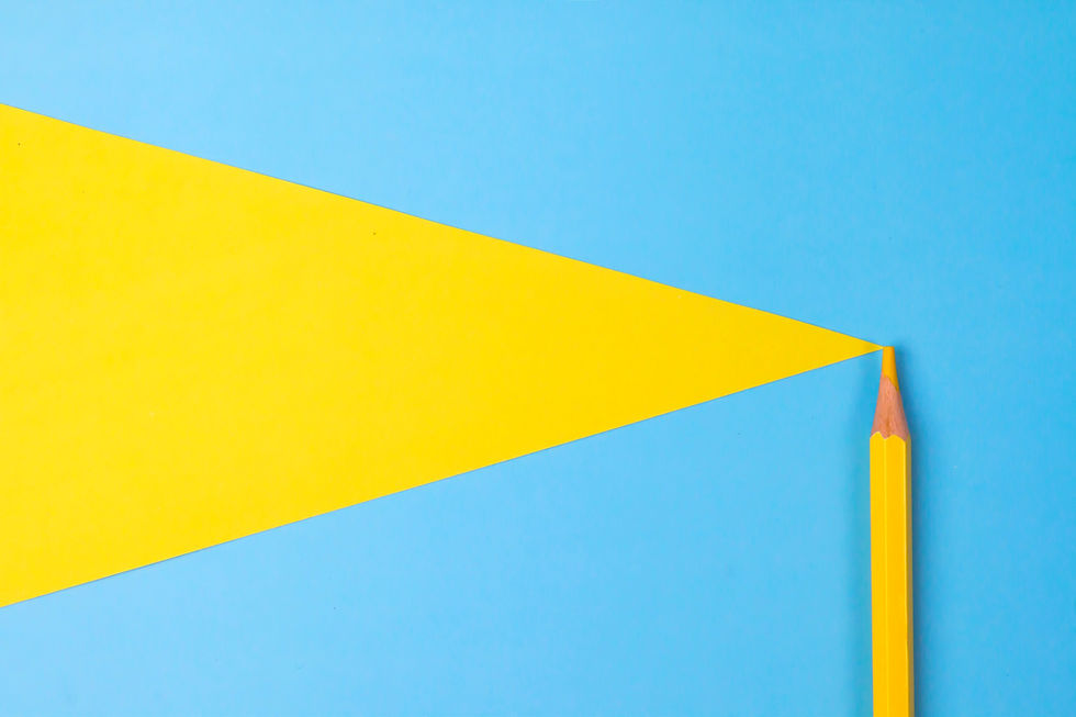 Yellow color pencil isolated on blue paper background_edited.jpg