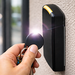 Hand with key fob near reader.png