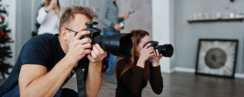 _vecteezy_the-team-of-two-photographers-shooting-on-studio-behind_10441617 copy.jpg