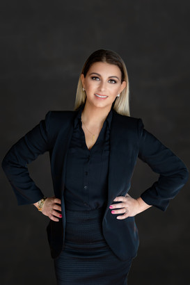 Female-in-black-business-suit-posing-for-branding-photo-by-Cary-Pennington