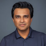 Headshot of a man in a blue shirt, an executive team member based in Carlsbad.