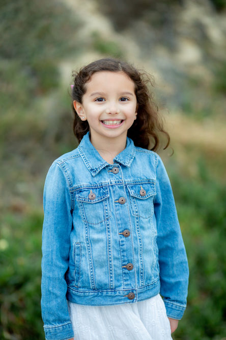 Young-girl-posing-for children-portrait-photo-Del Mar-Dog-Beach