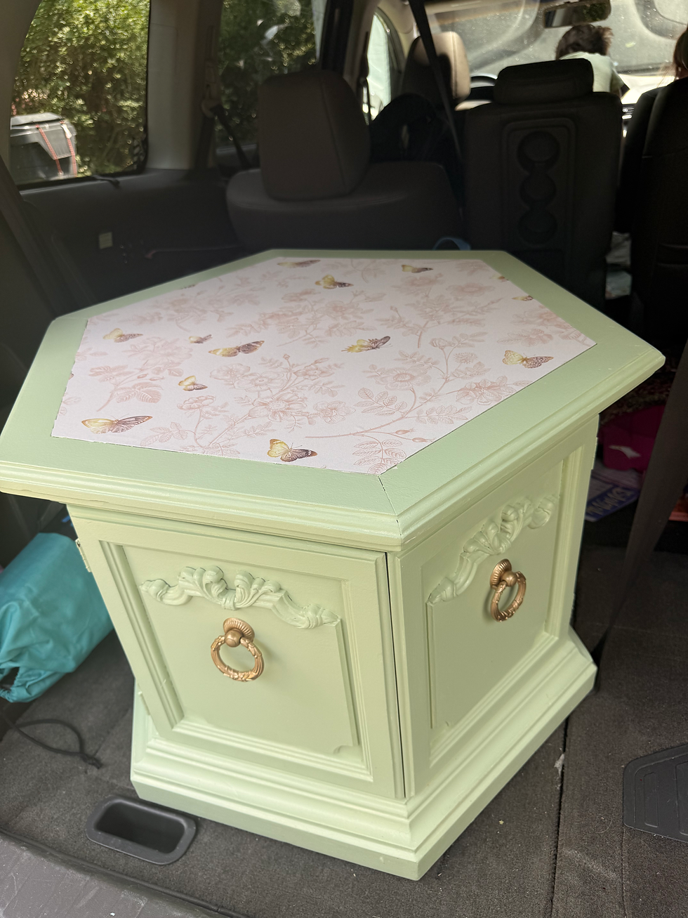 A simple white cabinet was turned into an art piece for the store!