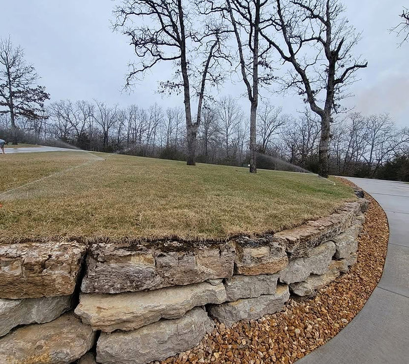 Stacking rock wall, with sod & irrigation