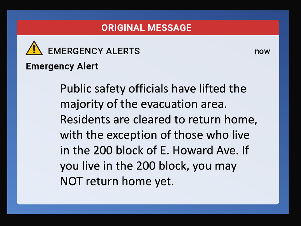 Emergency alert message: Evacuation lifted except for 200 block of E. Howard Ave. Blue and red text box with a warning icon.