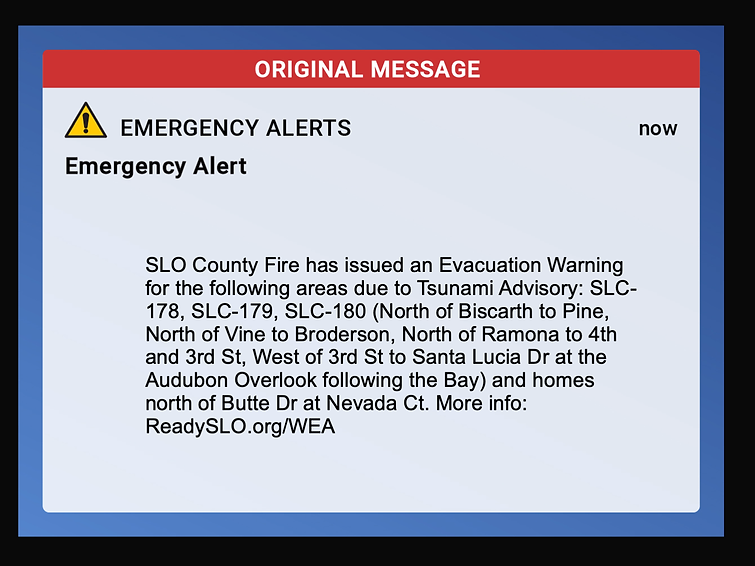 Emergency alert message on screen with evacuation warning for SLO County due to tsunami advisory. Text details affected areas.