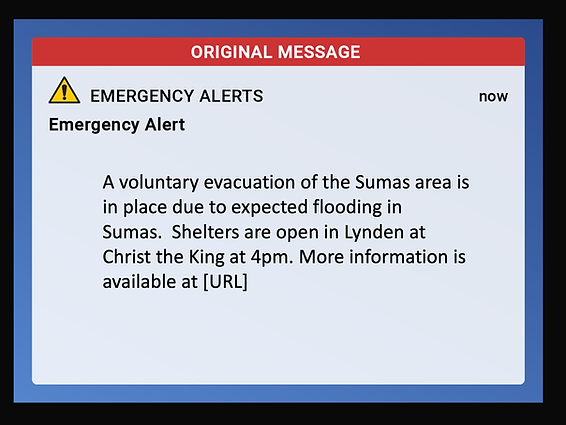 Emergency alert message about Sumas flooding; voluntary evacuation advised, shelters open in Lynden. Red and blue message box.