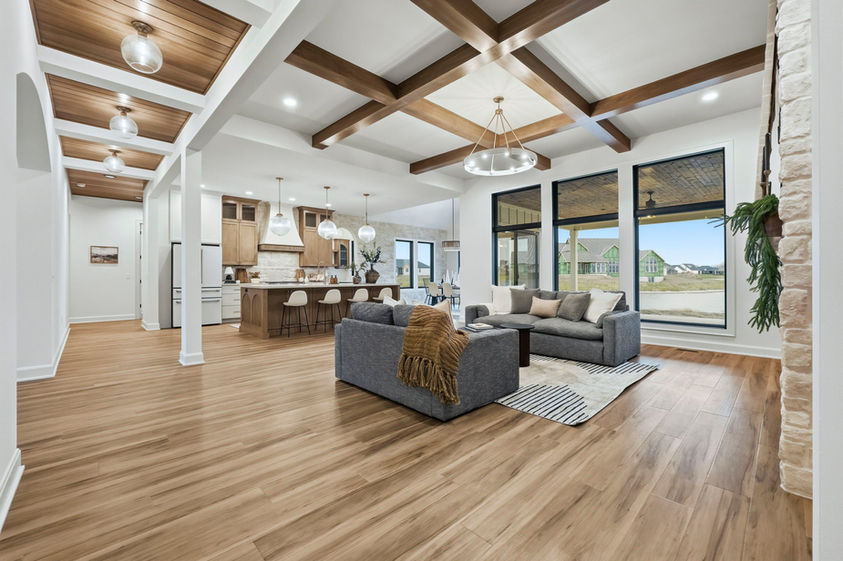 Living room with seating area and kitchen, ceiling detail