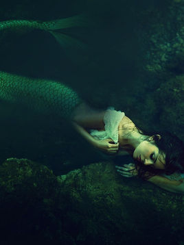 A mermaid in the sea.
