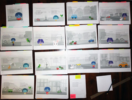 Foto mostrando testes das páginas internas do novo livro já com as ilustrações digitais.