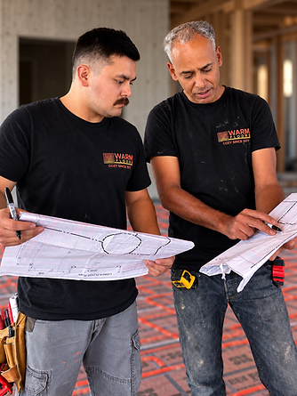 Workers Reviewing Radiant Floor Plans.png