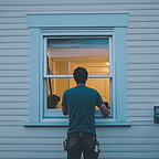u9672417141_man_installing_window_on_a_white_suburban_house_-_833537da-014f-4a12-b757-9e1b