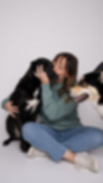Bre, Wilmington, NC pet photographer and The Photo District owner, poses with her dogs Isla and Roux in Princess St. studio