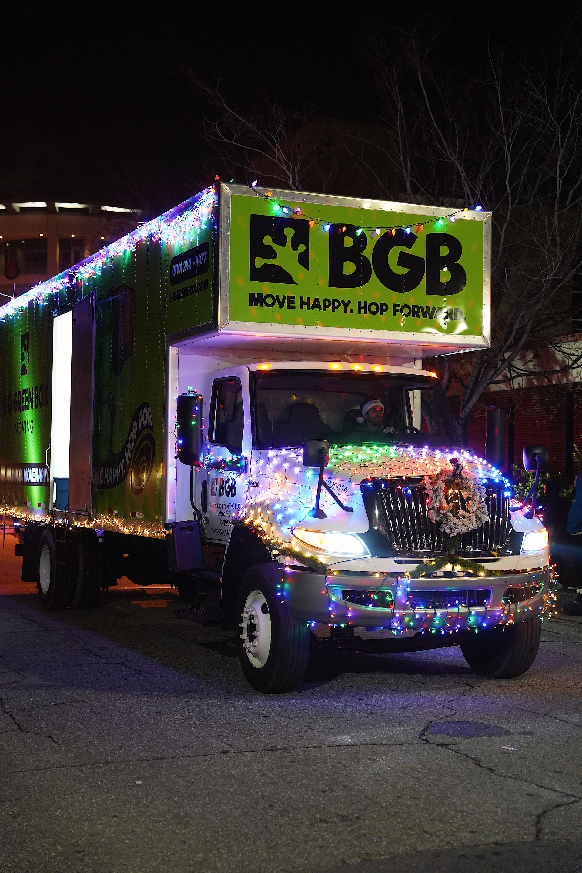 Big Green Box Moving truck decorated in Christmas lights and a wreath.