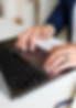 typing on a laptop, symbolizing strategic talent management, hiring support, and workforce development services offered by Lesley Herald Consulting.