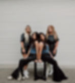 Almost Famous Salon hair stylists pose outside of AF Salon where they specialize in extensions and color.