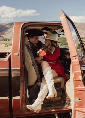 Country couple in the cab of vintage truck