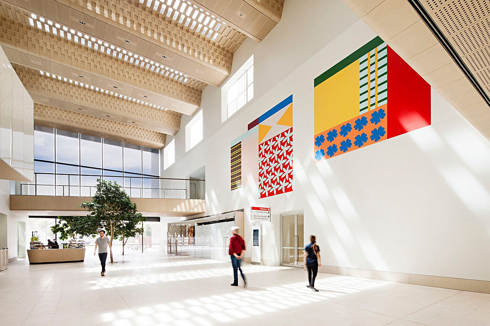 Spacious lobby with colorful artwork, people walking