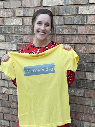 A yellow talks with shay tshirt for this quarter