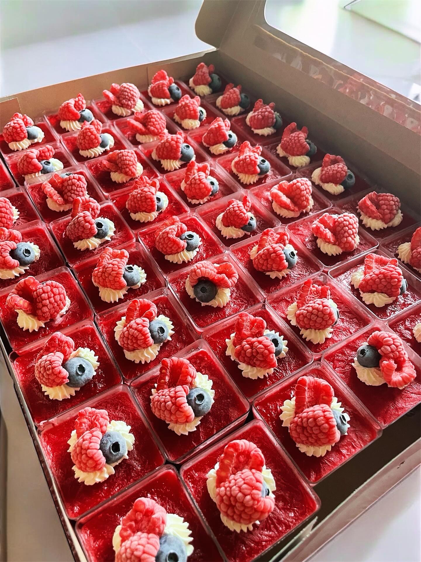 Grid of strawberry desserts prepared for an event
