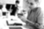 Girl scheduling an appointment on her phone, with blurred background.