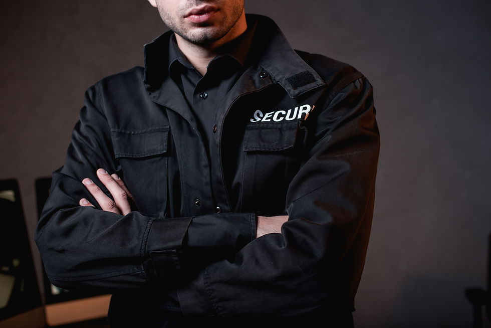 cropped-view-of-guard-in-uniform-with-crossed-arms-2026-03-11-07-04-50-utc (1).jpg
