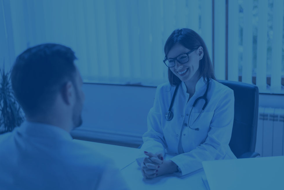 happy-female-doctor-discussing-with-patient-table-clinic_edited.jpg
