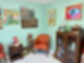 Welcoming counseling office in Wakefield, Rhode Island with artwork and armchair.