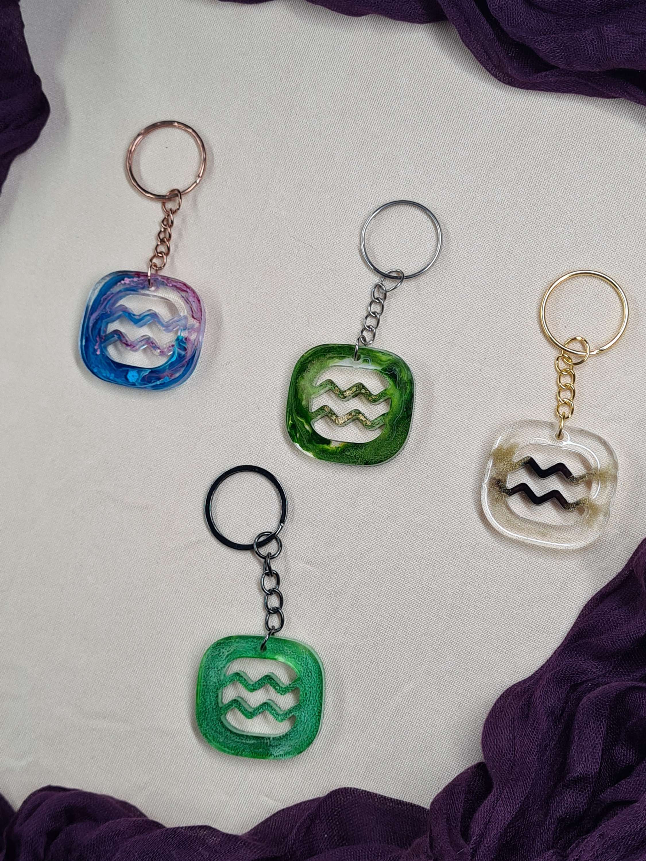 Porte clés carré astrologique Verseau