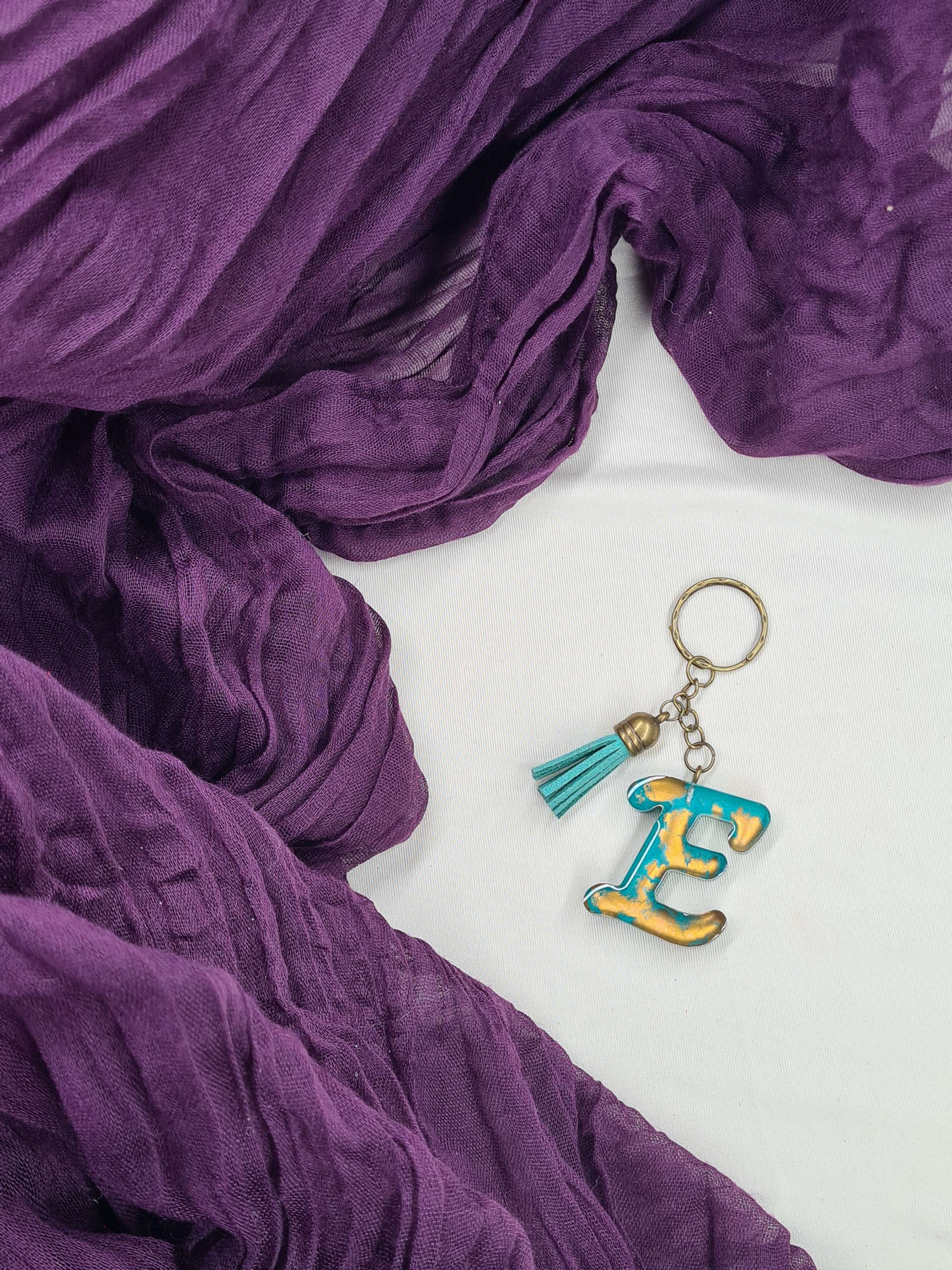 Porte clés lettre E modèle "Scripte"