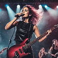 female rock singer performing with iem
