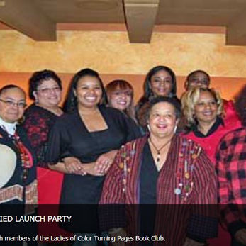 Image of Alretha Thomas with members of the Ladies of Color Turning Pages Book Club
