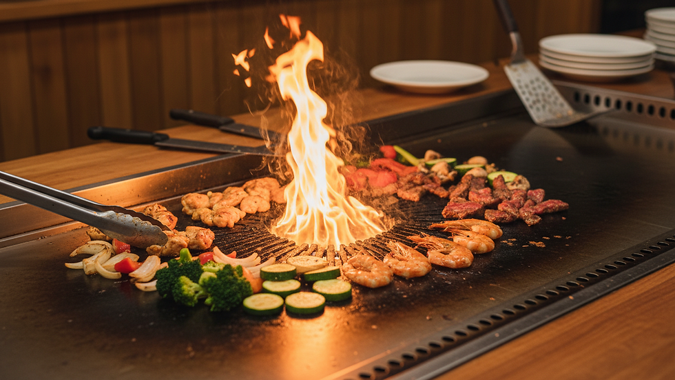 Eye-level view of a hibachi grill with sizzling vegetables and meats