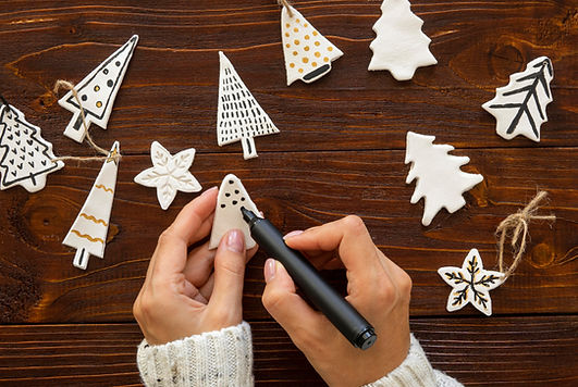 flay-lay-hands-drawing-christmas-tree-decorations.jpg